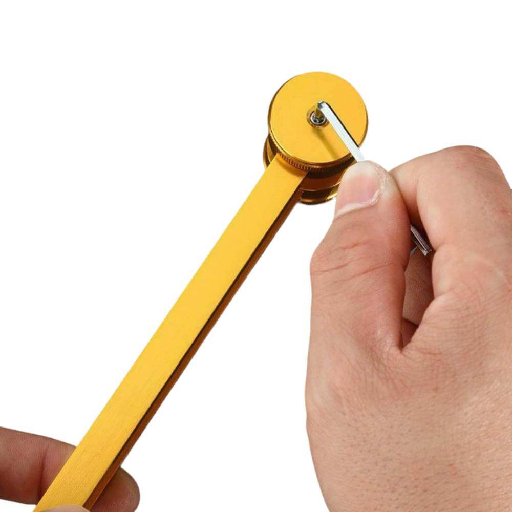 Hand holding gold tuning fork for vibration sound healing